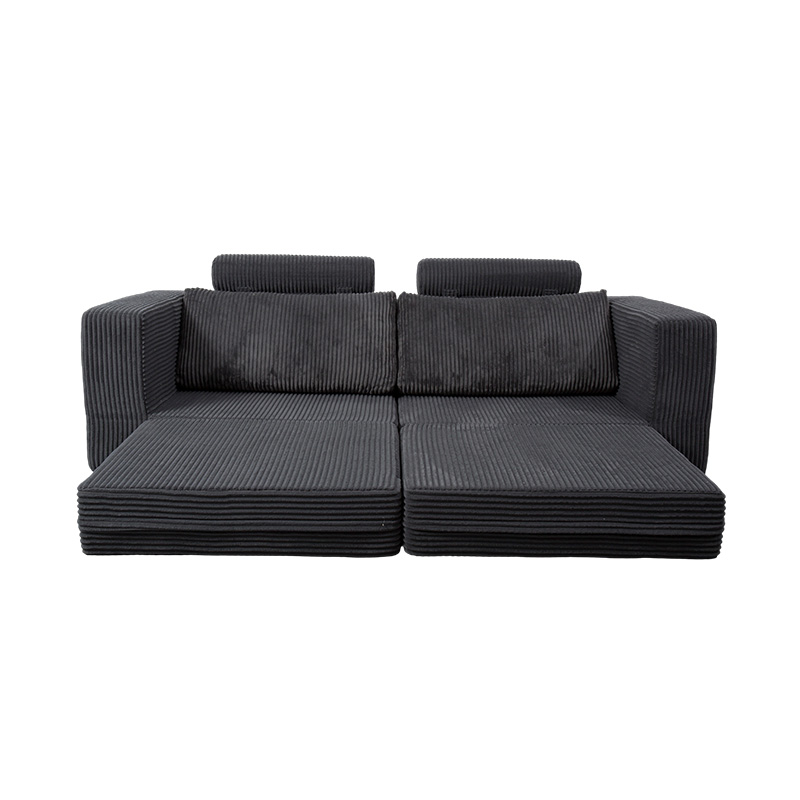 Moderne konvertibel sofa i mørkegrå kordfløyel med puter, fleksibel modulær layout