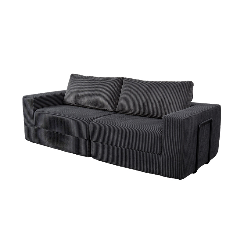 Moderne konvertibel sofa i mørkegrå kordfløyel med puter, fleksibel modulær layout